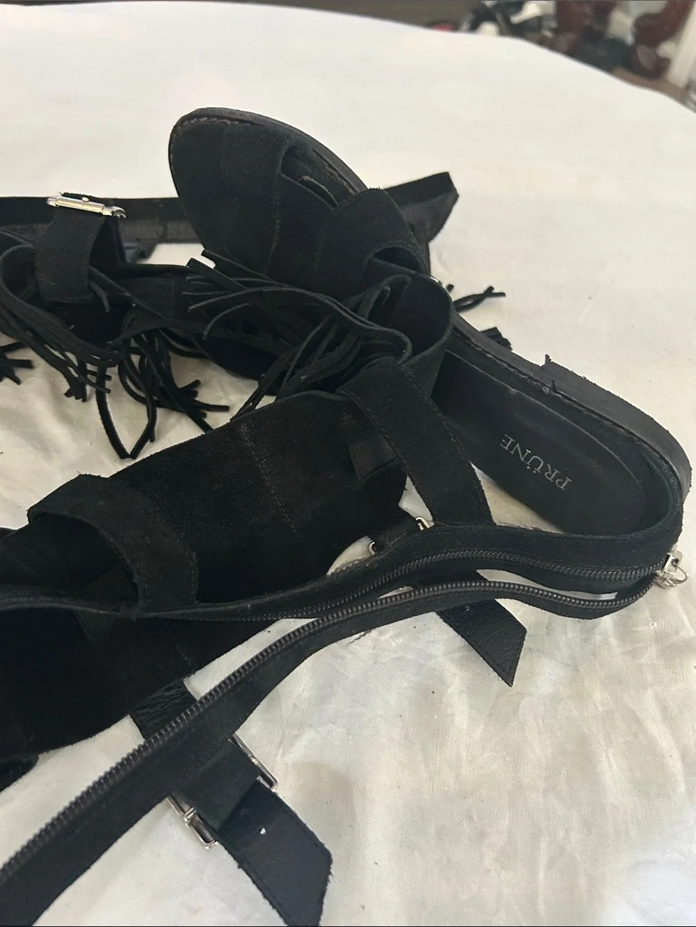 Prune Black Fringe Gladiator Sandals with Buckle Straps